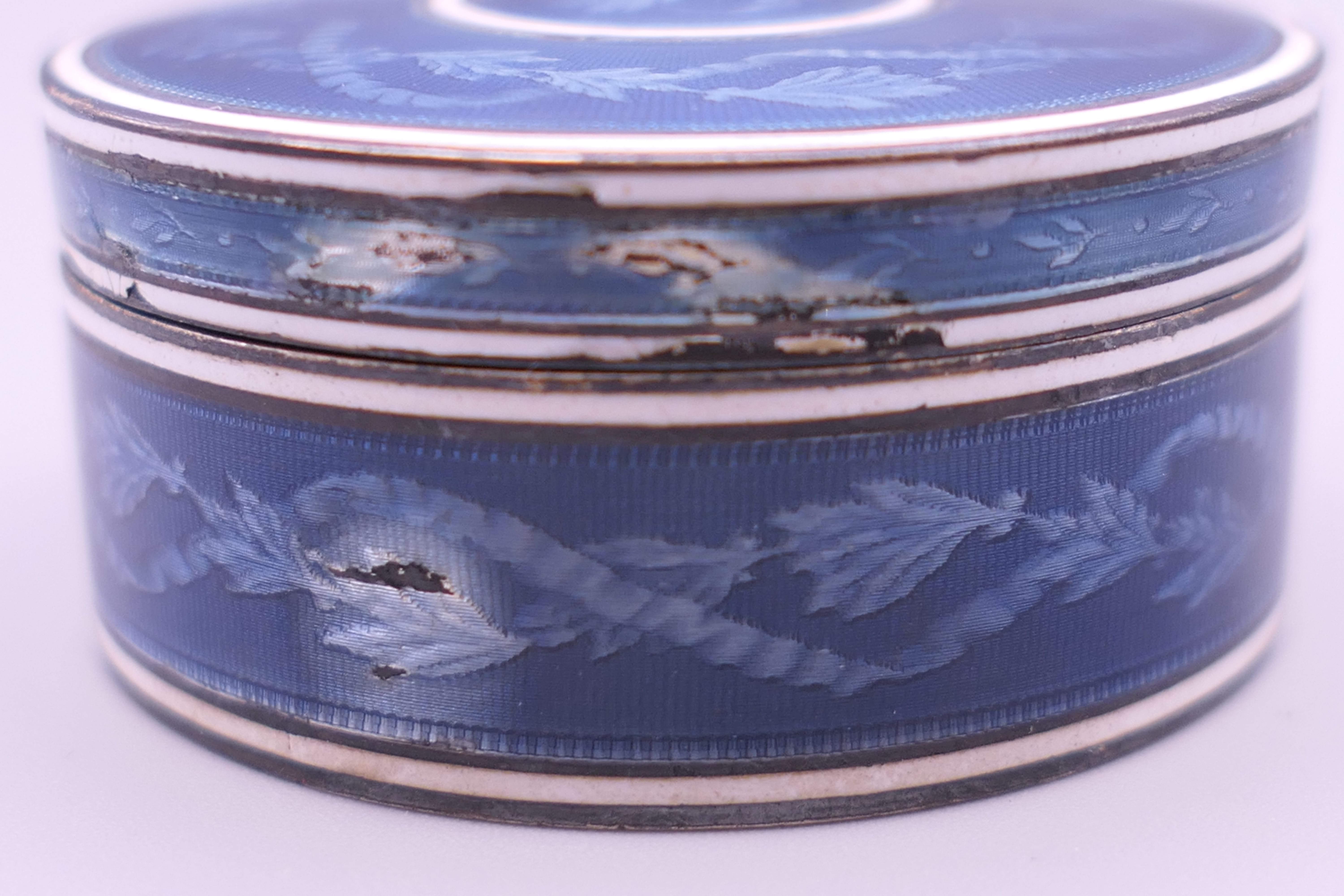 A Continental blue enamel decorated silver box. 4.5 cm diameter. - Image 4 of 9
