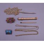 A 9 ct gold propelling pencil, two brooches, etc. The former 9 cm long and 11.