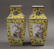 A pair of Chinese yellow porcelain square form vases. 25 cm high.