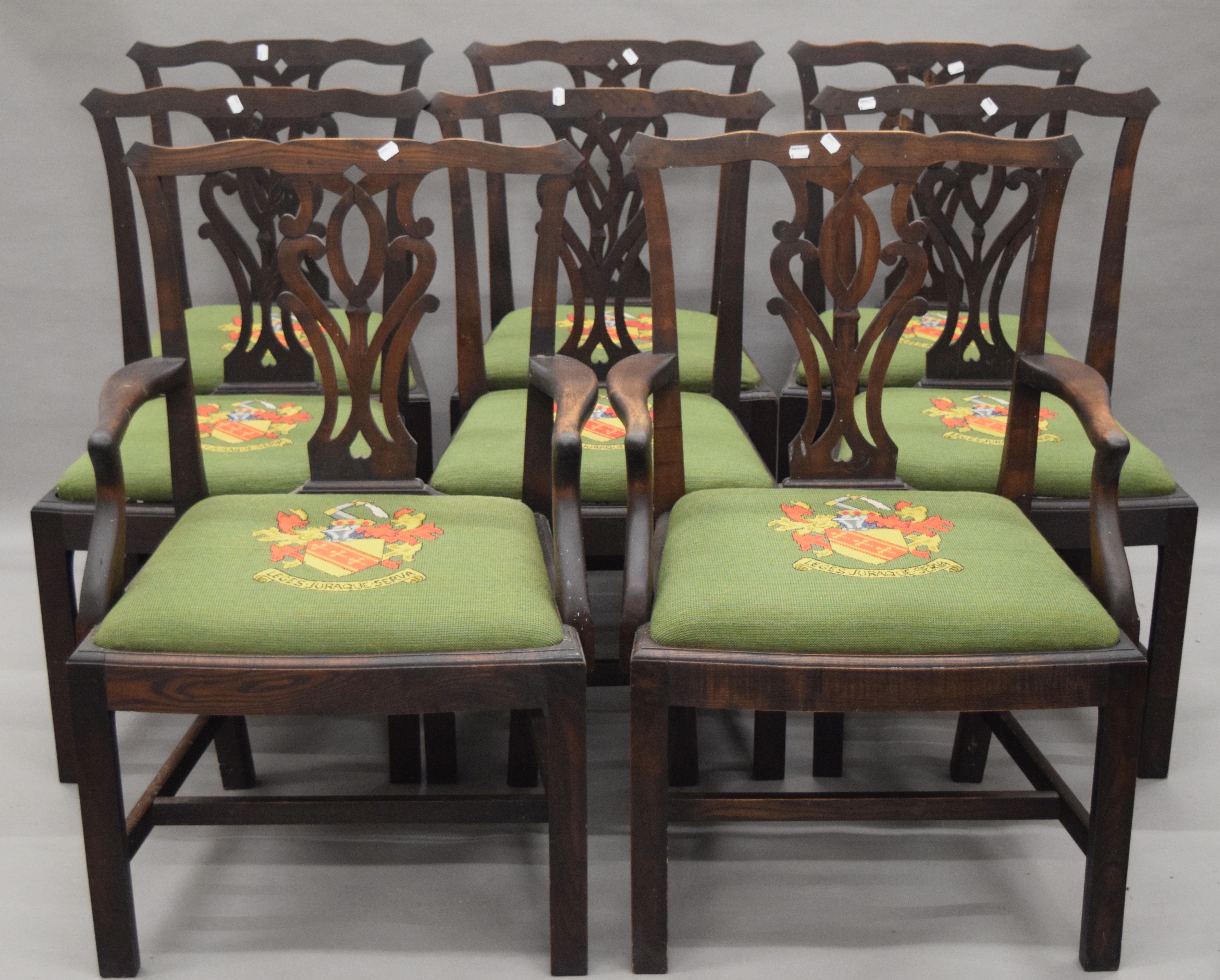 A set of eight oak Hepplewhite style dining chairs. The carvers each 64 cm wide.
