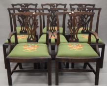 A set of eight oak Hepplewhite style dining chairs. The carvers each 64 cm wide.