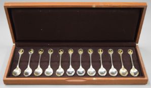 A cased set of RSPB silver teaspoons. 13.5 cm long. 325.4 grammes total weight.