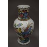 A 19th century Chinese porcelain vase decorated with birds amongst floral sprays. 49 cm high.