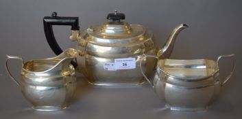 A matched three-piece silver tea set. The teapot 27 cm long. 825.4 grammes total weight.
