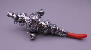An 800 silver baby's rattle. 16 cm long.