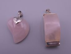 Two silver and rose quartz pendants. The largest 4.5 cm high.