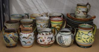 A collection of Glyn Colledge Denby pottery jugs, tankards and plates.