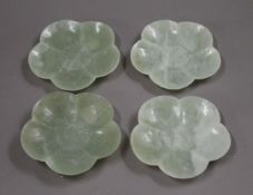 Four jade lobed dishes. 12 cm diameter.