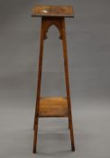 A late 19th/early 20th century oak plant stand. 108 cm high.