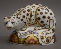 A Royal Crown Derby snow leopard paperweight. 12 cm high.