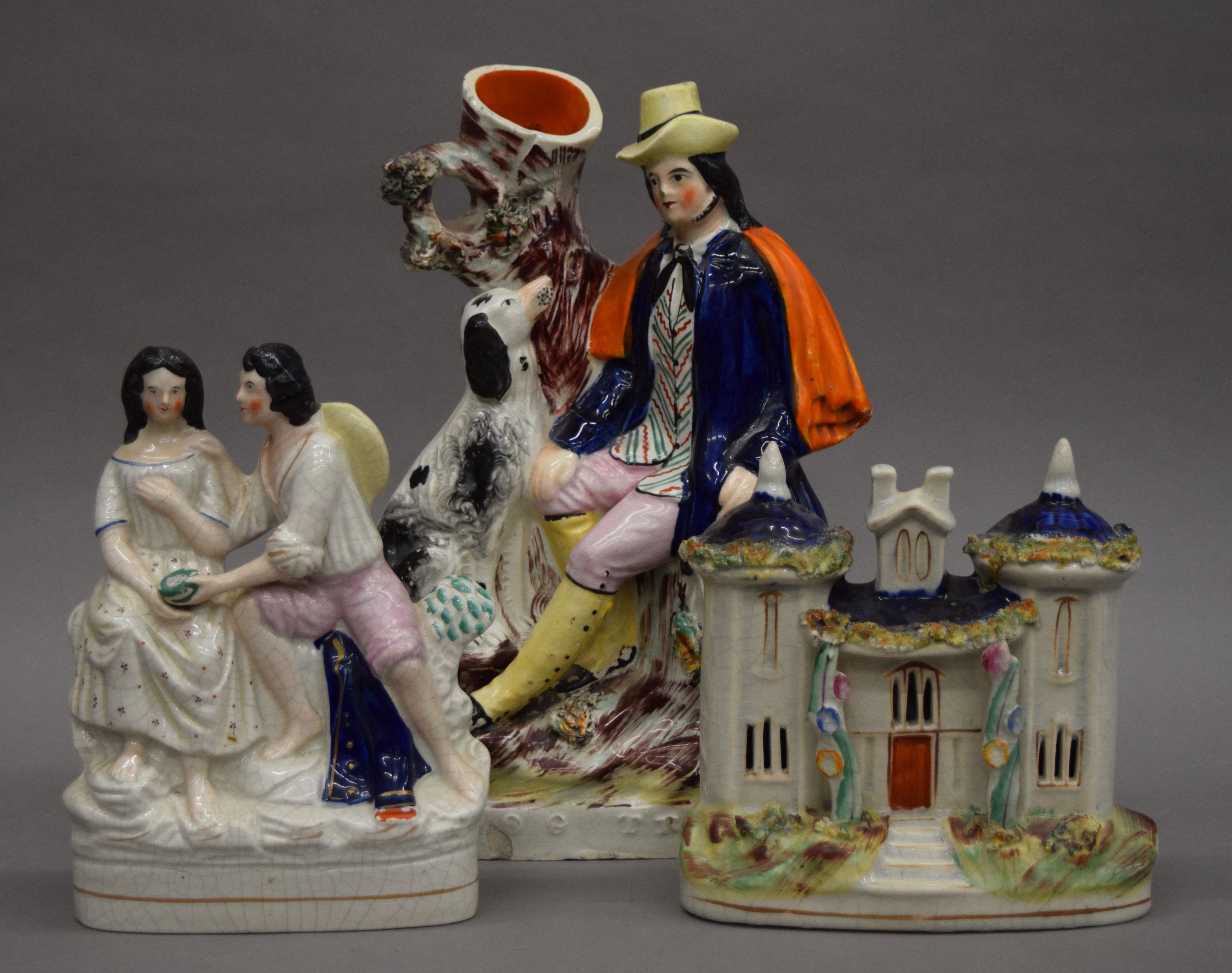 Two Victorian Staffordshire figures and a Staffordshire house. The largest 32.5 cm high.