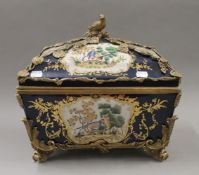 A large gilt metal mounted porcelain casket. 37 cm wide.