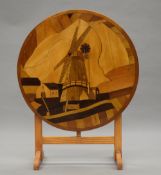 An Art Deco inlaid folding coffee table. 58 cm diameter.