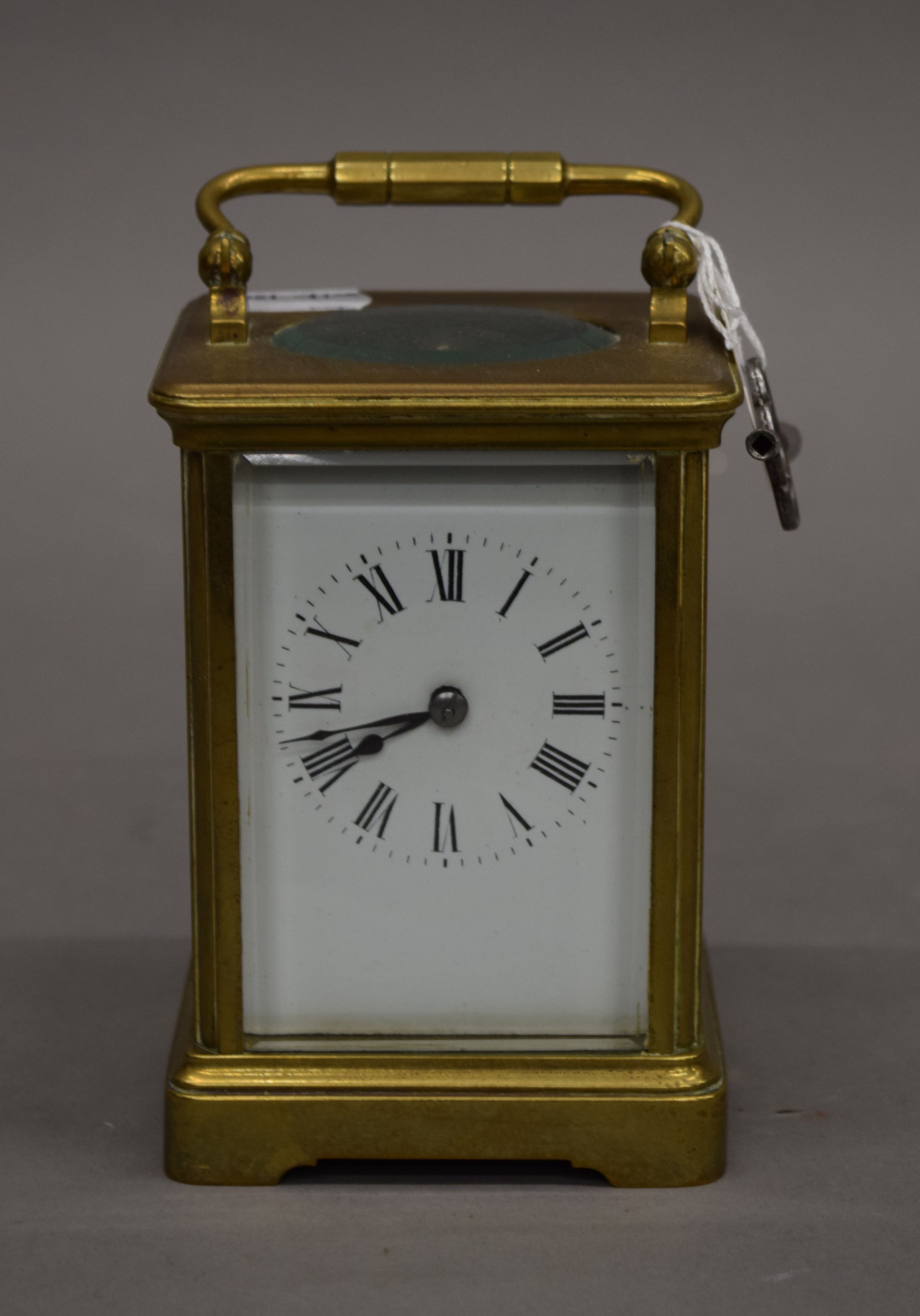 A French brass cased carriage clock. 15 cm high.