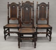 Four 17th century style oak solid seated chairs.
