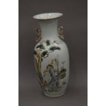 A 19th century Chinese porcelain vase decorated with scholars and boys. 58 cm high.