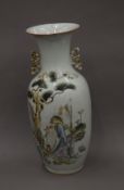 A 19th century Chinese porcelain vase decorated with scholars and boys. 58 cm high.