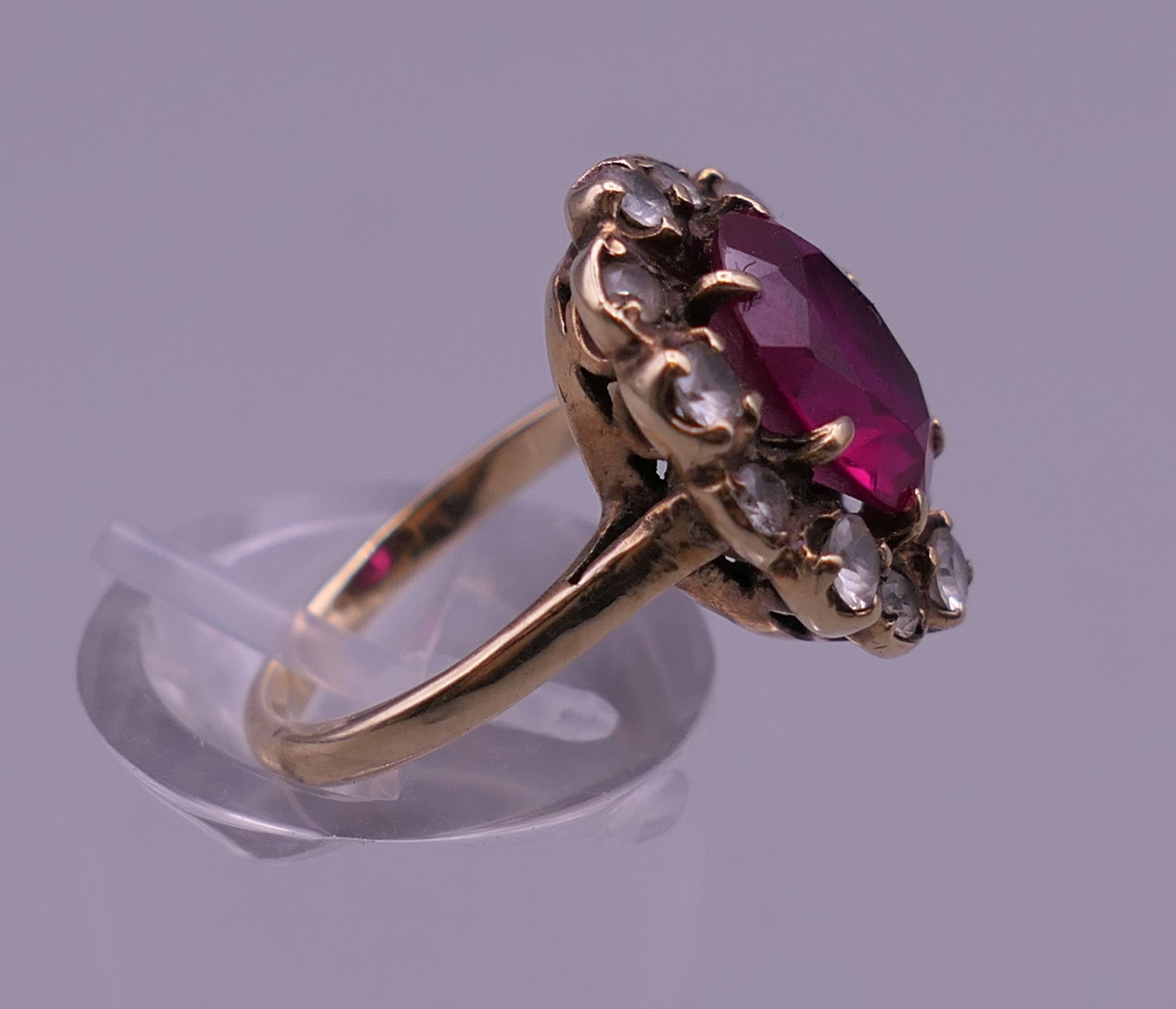 A 9 ct gold red stone ring. Ring size H. - Image 2 of 6