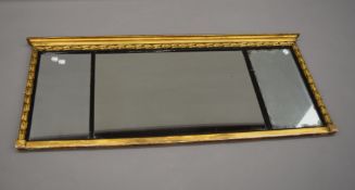 A 19th century gilt framed over mantle mirror. 119 cm wide, 50.5 cm high.