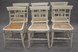 A set of six painted cane seated 19th century chairs. 45 cm wide.