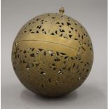 A large Eastern brass ball form incense burner. Approximately 19 cm high.