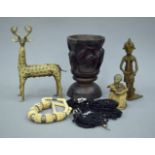 A quantity of African carvings, models and two necklaces.