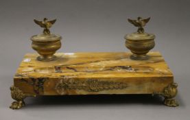 A bronze mounted Sienna marble desk stand. 36 cm wide.