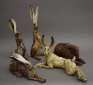 Five pottery models of hares. The largest 40.5 cm high.