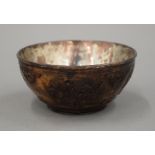 An 18th century Chinese carved coconut bowl. 12 cm diameter.