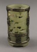 A jade brush pot with metal mount. 13 cm high.