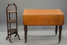 A Victorian mahogany Pembroke table and a three-tier folding cake stand.