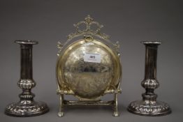 A pair of Sheffield plated candlesticks, circa 1820 and a silver plated muffiniere. The former 16.