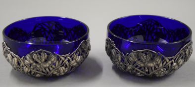 Two Chinese silver and blue glass bowls. 12 cm diameter. 175.9 grammes.