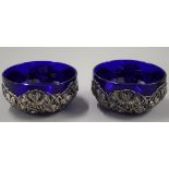 Two Chinese silver and blue glass bowls. 12 cm diameter. 175.9 grammes.