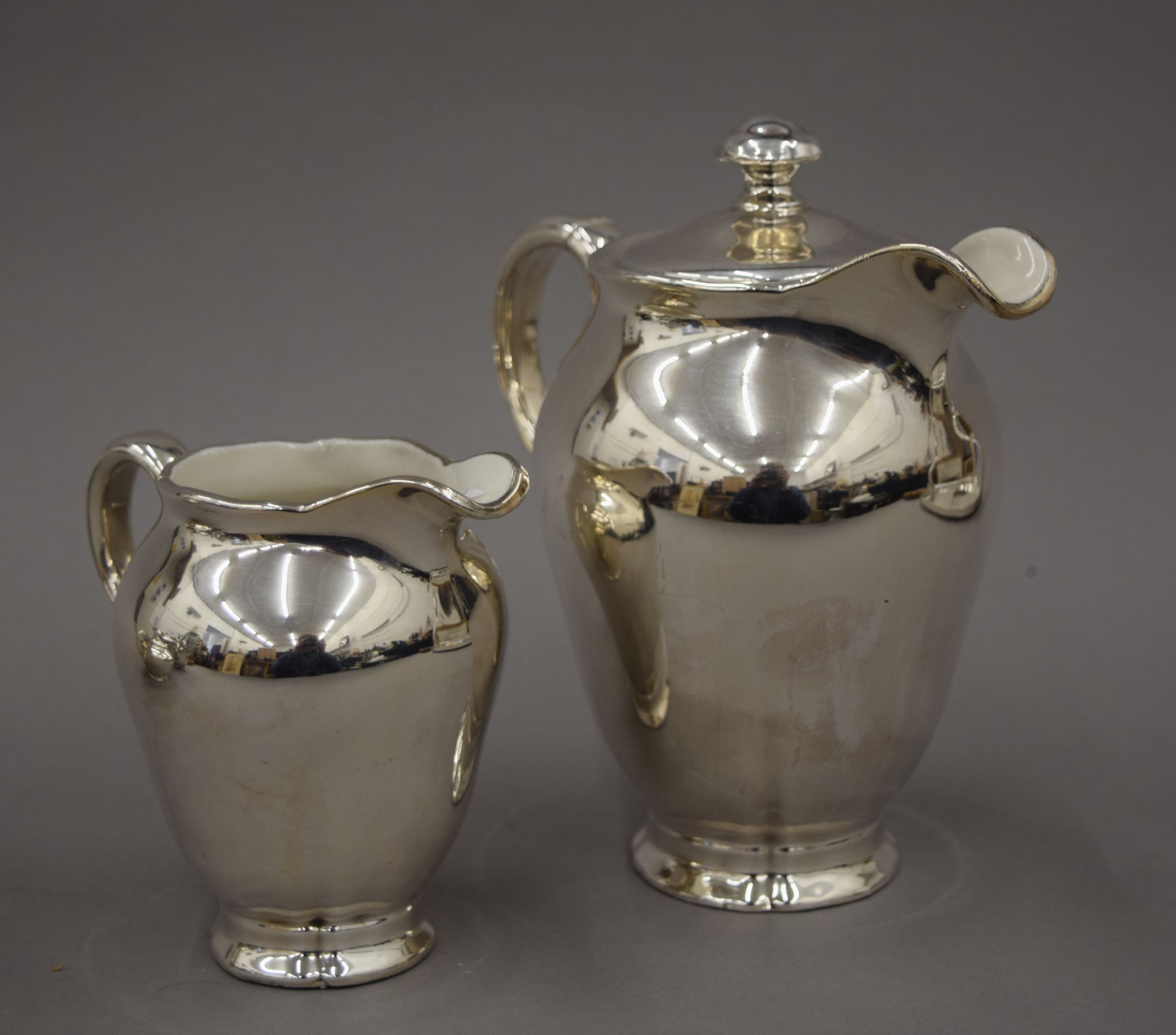 A three-piece silver plated tea set and a three-piece porcelain and silver overlaid tea set and an - Image 4 of 10