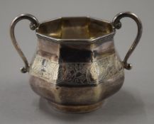A silver sugar bowl. 11.5 cm wide. 176.1 grammes.