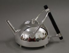 A Christopher Dresser style teapot. 15 cm high.