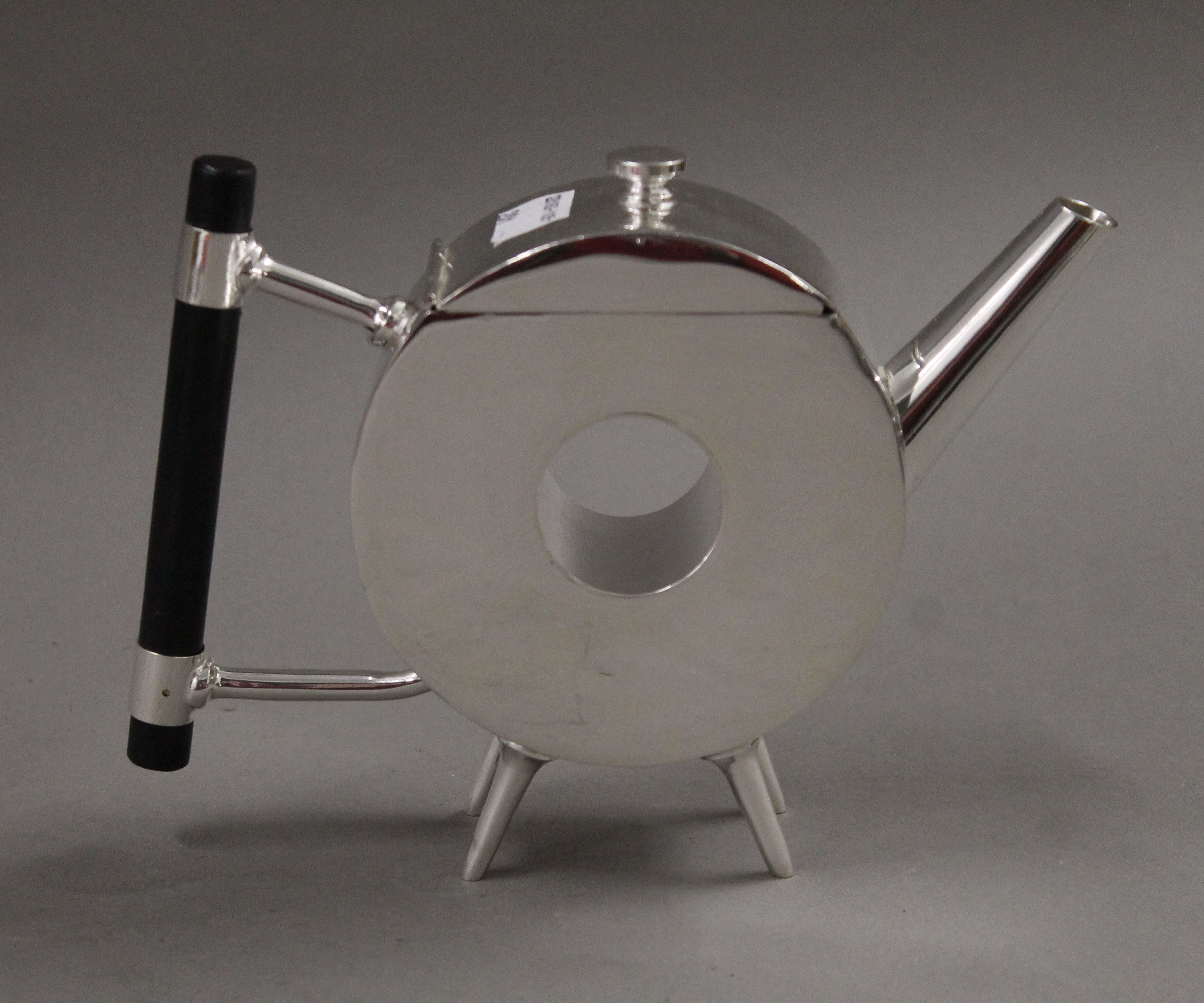 A Christopher Dresser style teapot. 13.5 cm high.