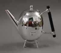 A Christopher Dresser style teapot. 17 cm high.