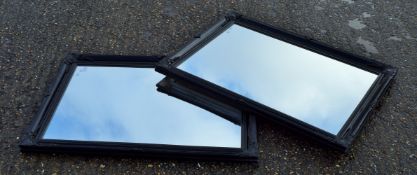 Two black framed mirrors. 74 x 105 cm.