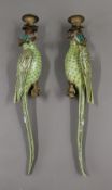 A pair of gilt metal mounted porcelain parrot form wall sconces. 47 cm high.