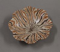 A small Chinese brown pottery dish. 10.5 cm diameter.