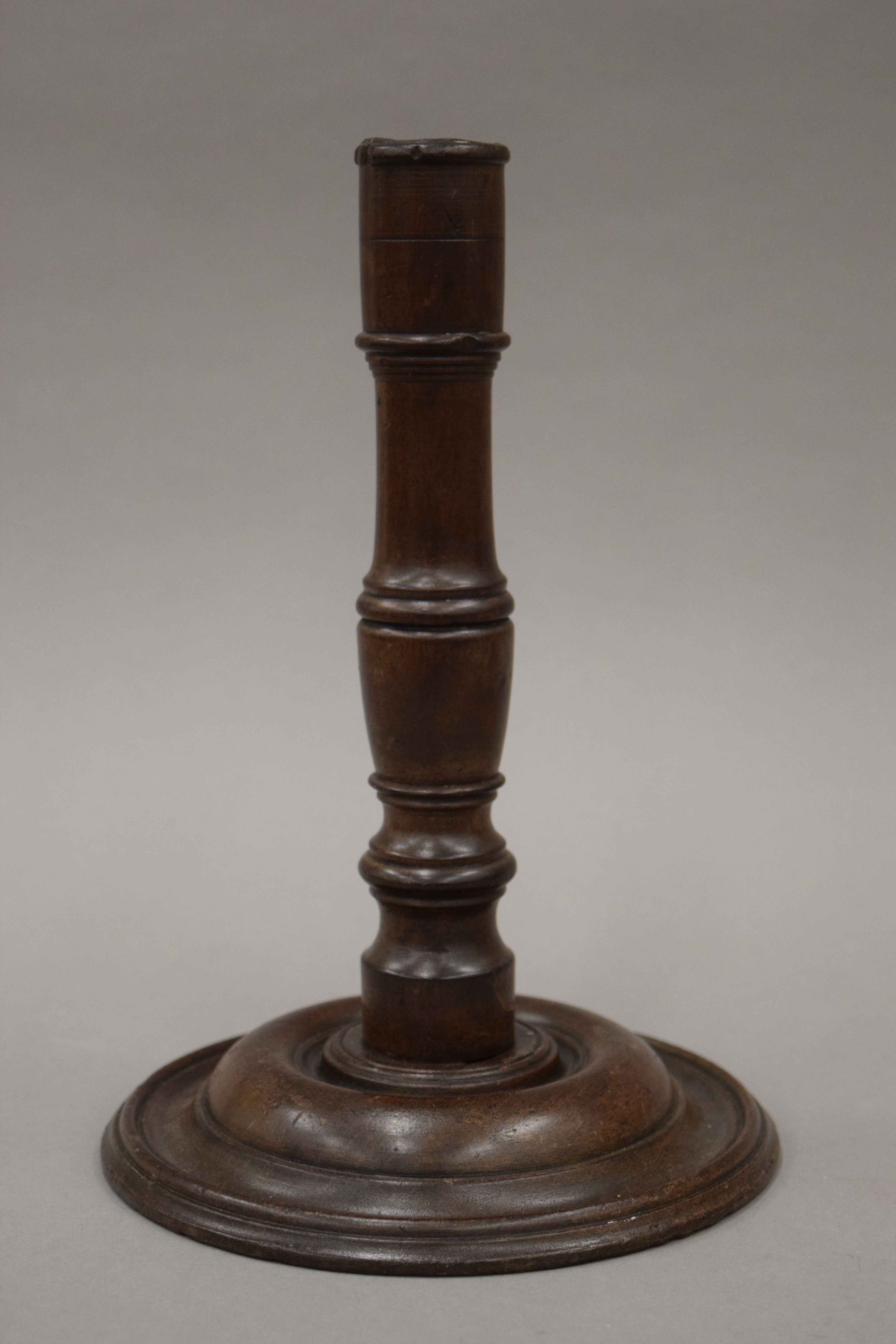 A 19th century turned wooden candlestick. 24.5 cm high. - Image 2 of 4