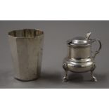 A silver mustard pot and an 835 silver beaker. The latter 8 cm high. 173.2 grammes.