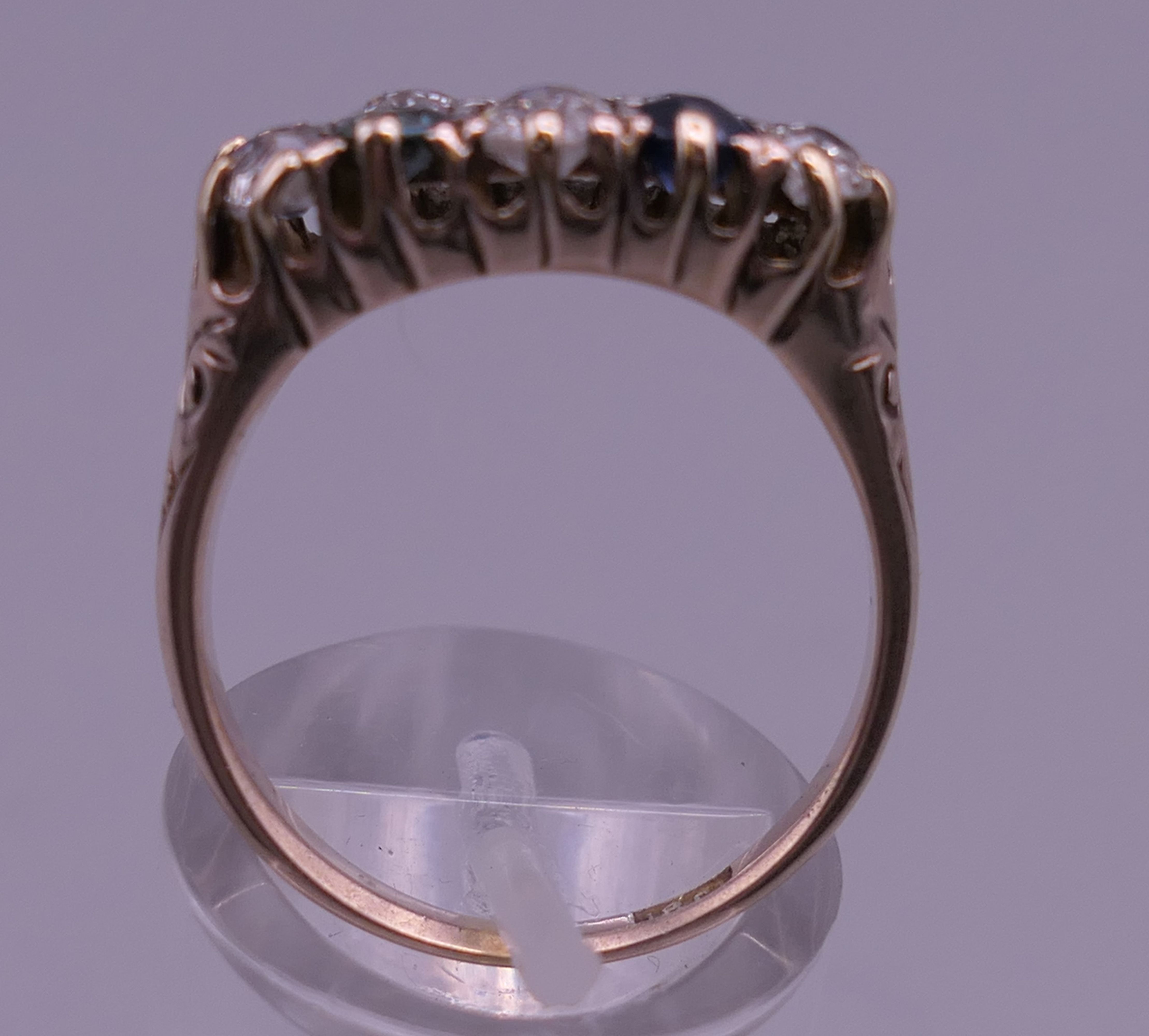 An 18 ct gold diamond and sapphire ring. 8 mm high, 17 mm wide. Ring size Q/R. - Image 3 of 8