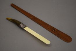 A Victorian horn handled page turner and another. The former 31.5 cm long.