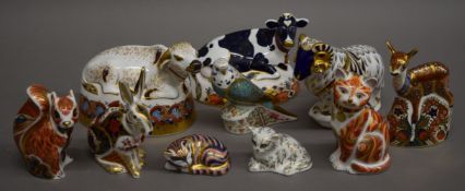 A collection of ten Royal Crown Derby paperweights. The largest 14 cm high.