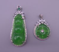 Two Art Deco style jade pendants. The largest 6 cm high.