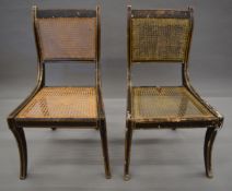 A pair of early 19th century cane seated painted chairs.