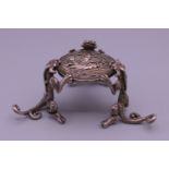 A Chinese miniature silver fo dog table. 4 cm high.